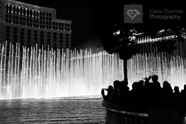 People photographing the fountain show at the Bellagio