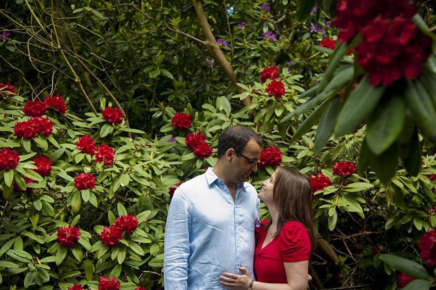 Couple surrounded by flowers in park