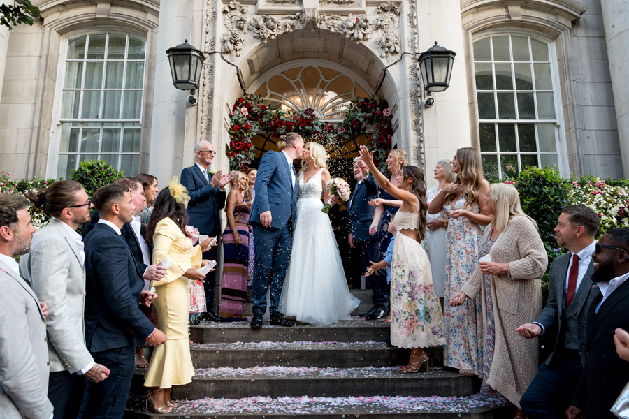 Group photos outside a Town Hall after a wedding ceremony