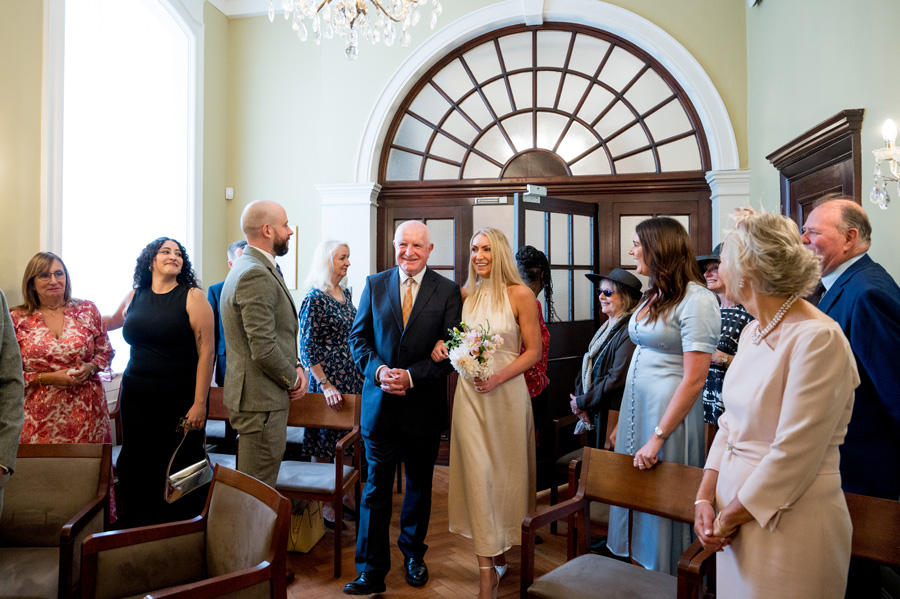 Short aisle inside a Town Hall wedding ceremony room