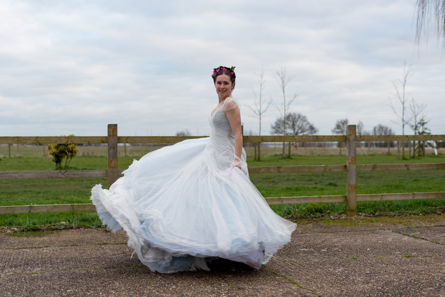 Bride swinging her dress