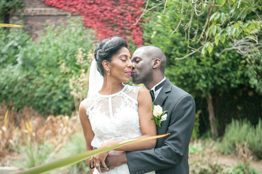 Couple hugging in gardens
