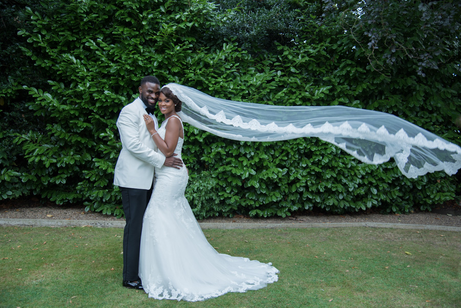 Bride and groom with vintage upcycled veil