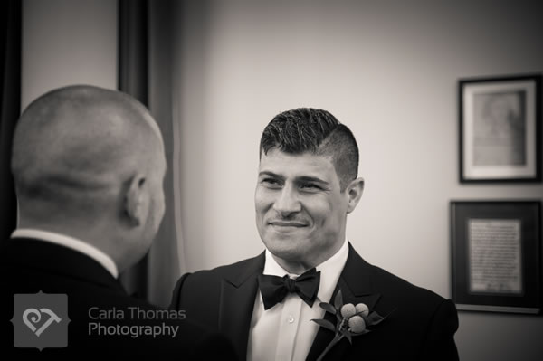 Grooms share look while reciting their wedding vows
