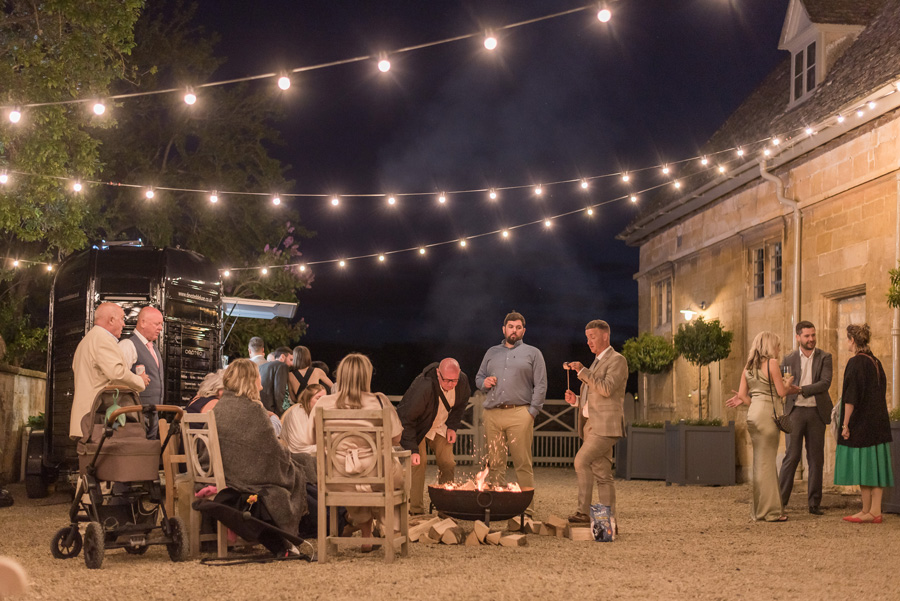 Relaxed evening wedding reception with guests mingling