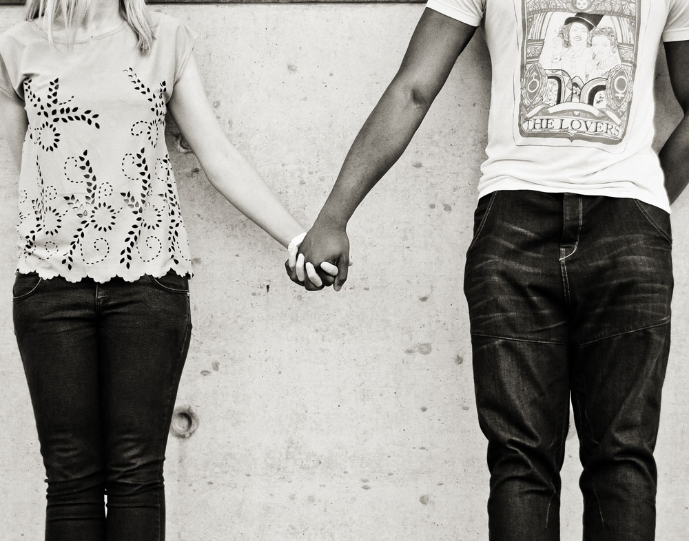 Couple holding hands