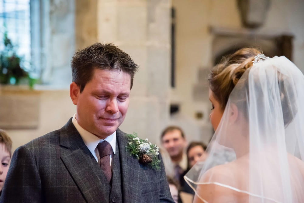 Groom crying at the altar