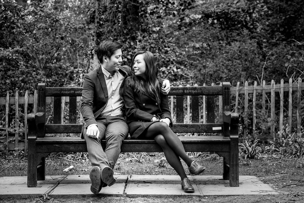 B&W of couple sat on bench