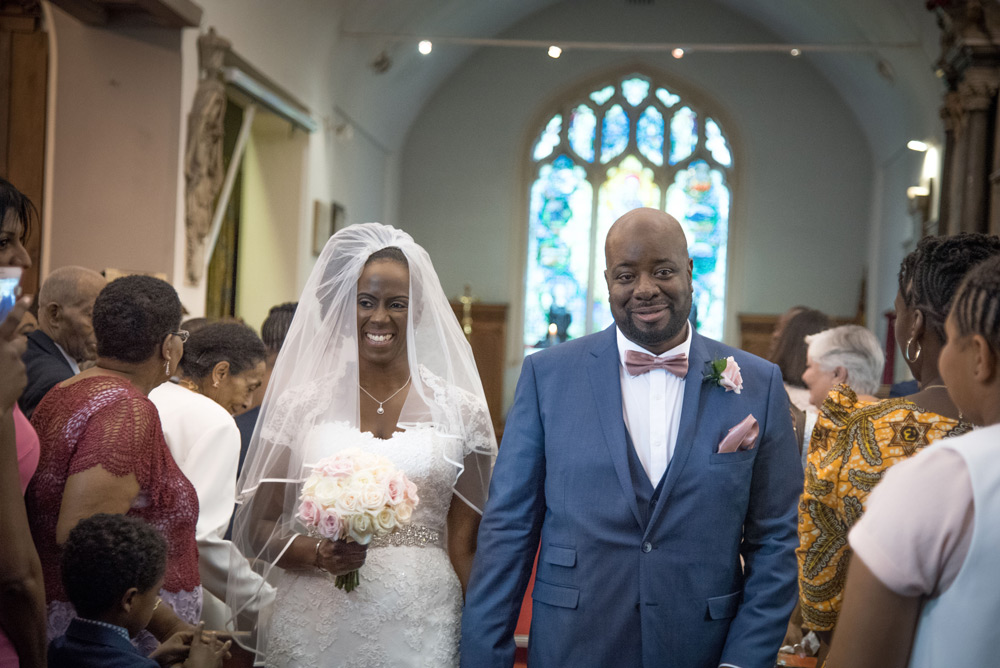 Bride and groom walking down the aisle