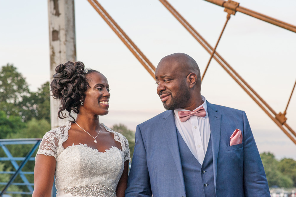 Couple walking over bridge
