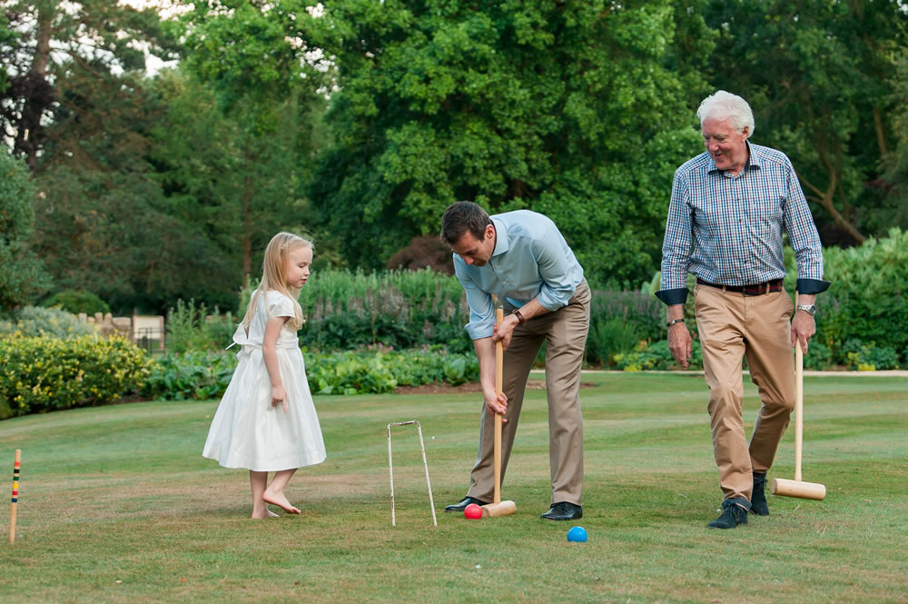 Guests playing croquet