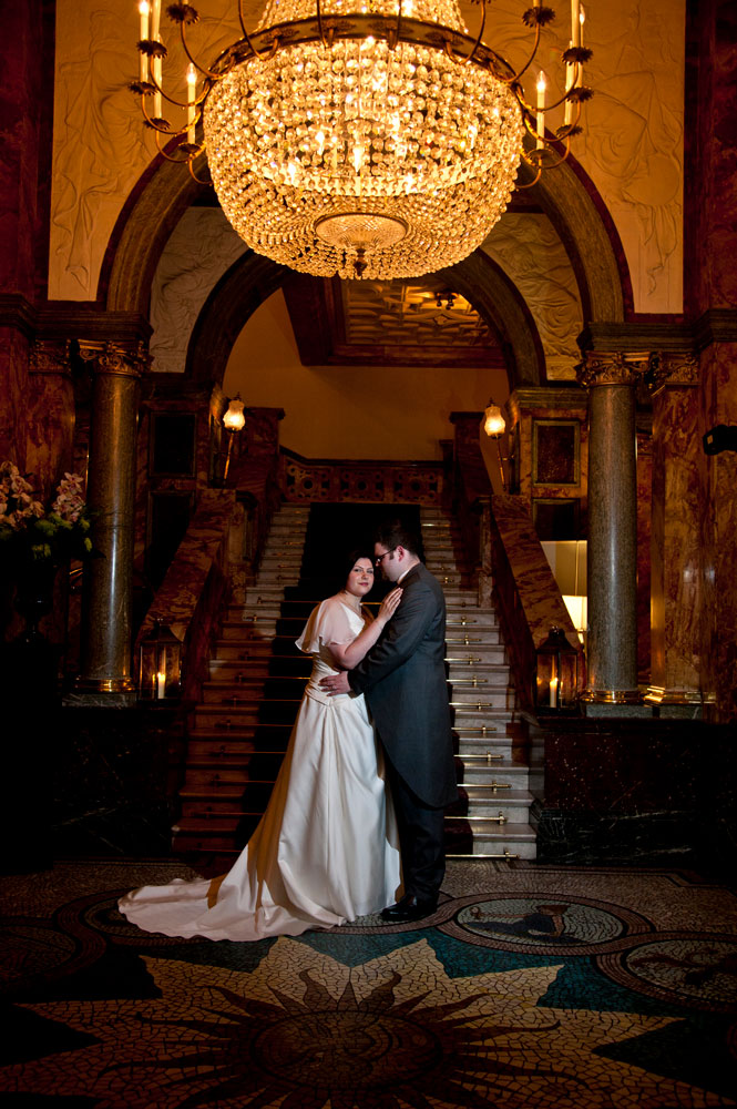 Bride and groom portrait in hotel lobby