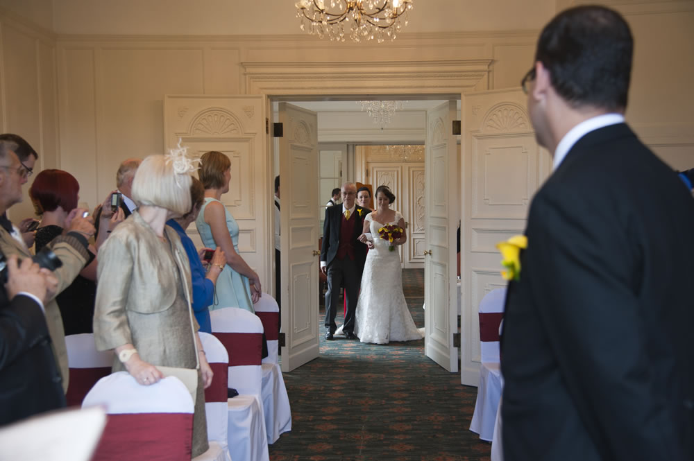 Bride and father entering the cermeony room