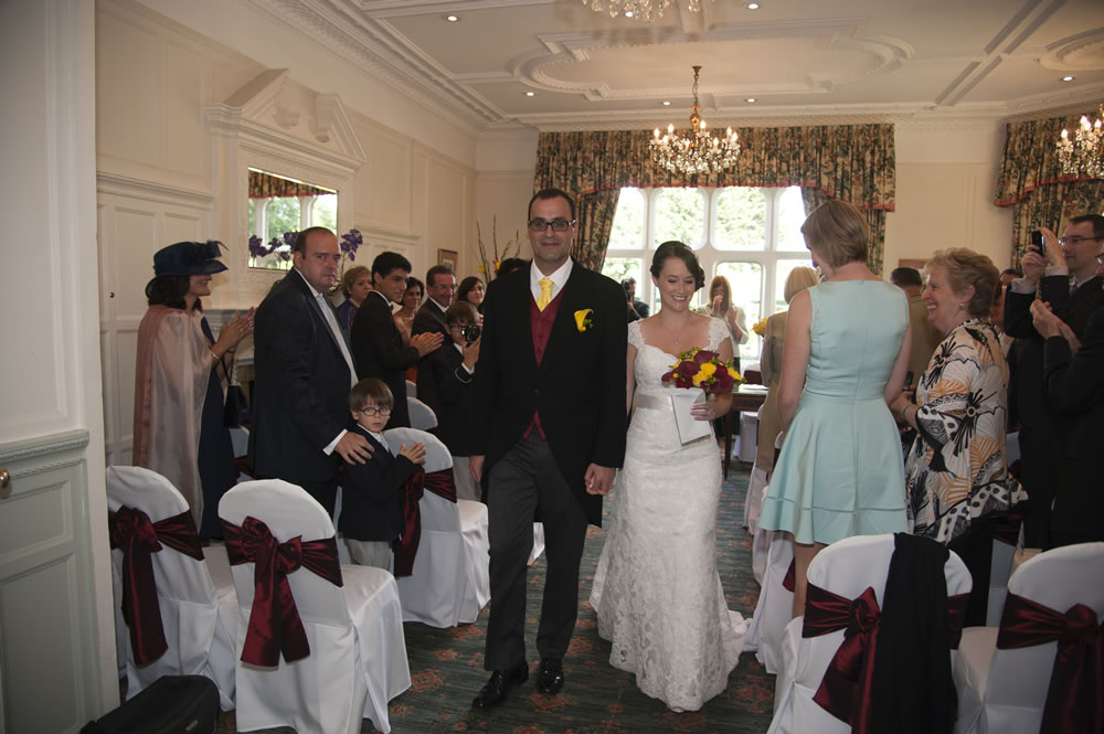 Couple leaving wedding ceremony