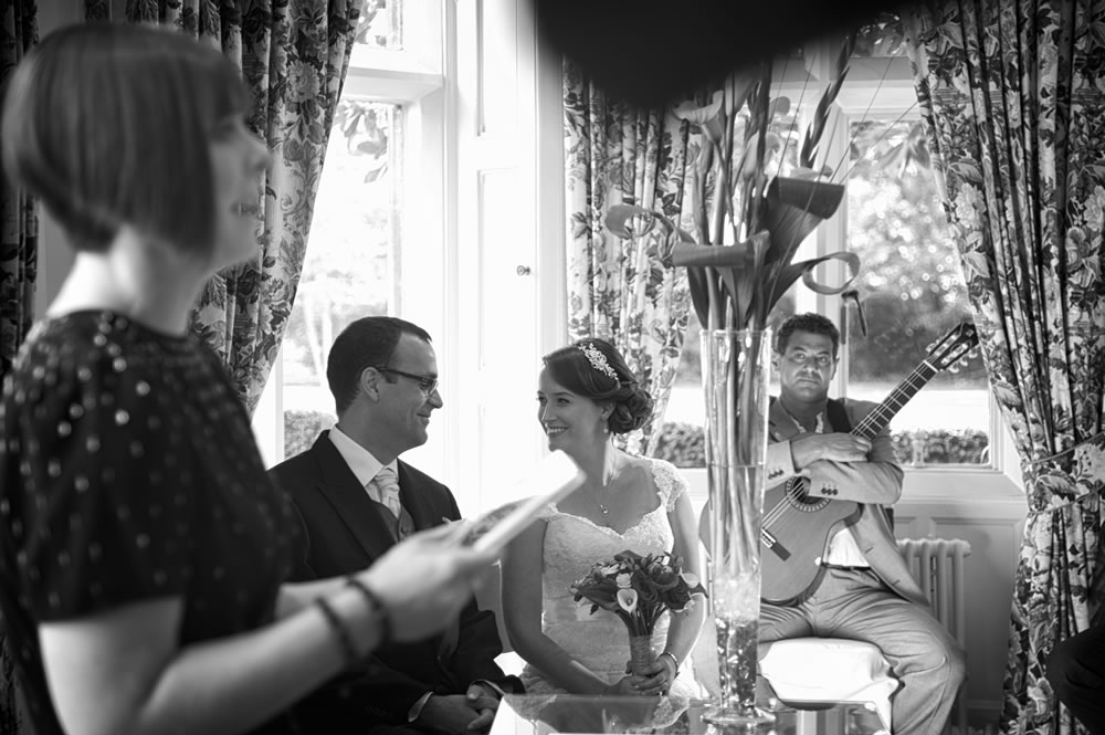 Bride and groom looking at each other during the reading